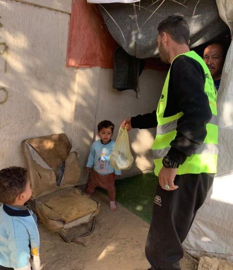 feeding small boy in palestine
